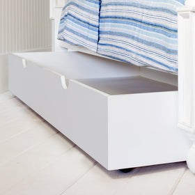The Trundle Bed fits neatly under your Newport Cottages bed or bunk bed. This option adds an extra bed for company. When not in use, it slides perfectly under the main bed and it can be used as a storage space that doesn't sacrifice any additional room.