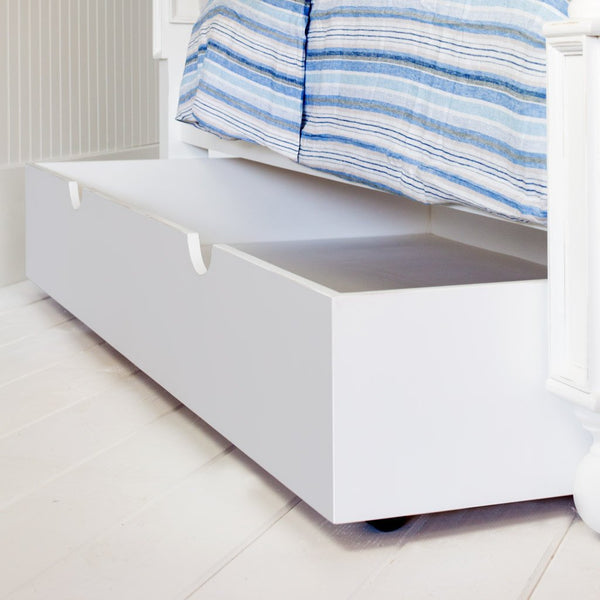 The Trundle Bed fits neatly under your Newport Cottages bed or bunk bed. This option adds an extra bed for company. When not in use, it slides perfectly under the main bed and it can be used as a storage space that doesn't sacrifice any additional room.